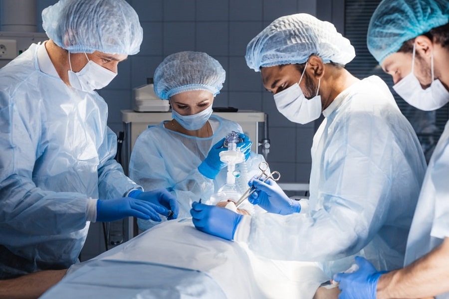 in General Surgery, surgeon team operating in an operating theatre